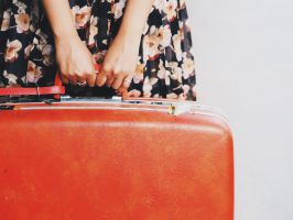 close-up-woman-hand-holding-vintage-suitcase-travel-concept_t20_pxnyvd.jpg