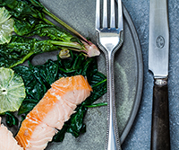 Hot smoked salmon, wilted spinach and lemon salad